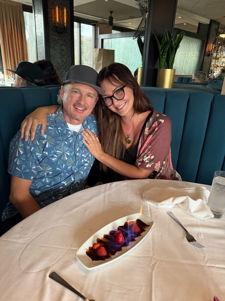 Kris Bradley and her husband celebrating at a Maui restaurant.