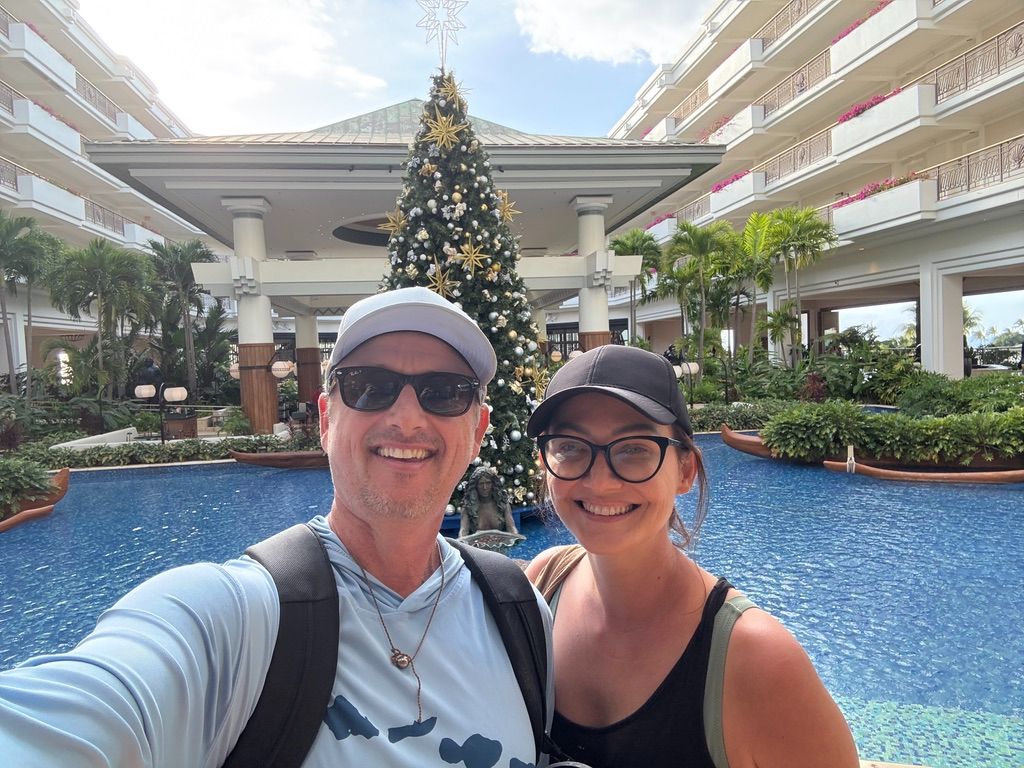 Kris Bradley and her husband at a Maui resort pool.