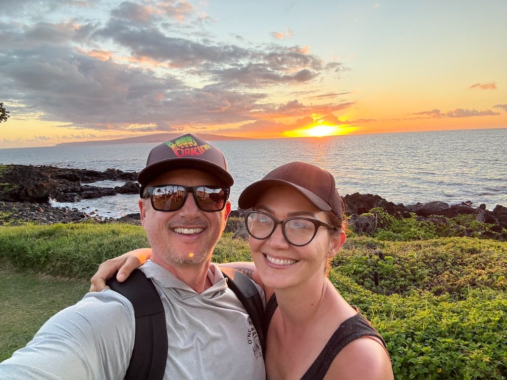 Kris Bradley and her husband at sunset on the Maui coast.