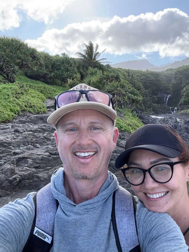 Kris Bradley and her husband hiking to a Maui waterfall.